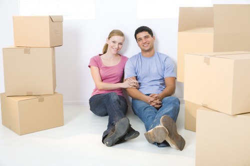 Professional movers handling furniture during removals in Southwoodford