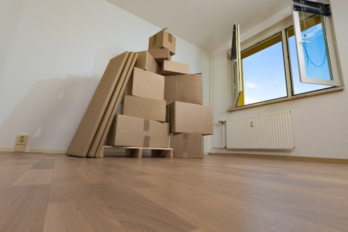 A moving team loading items for a Southwoodford flat move with care
