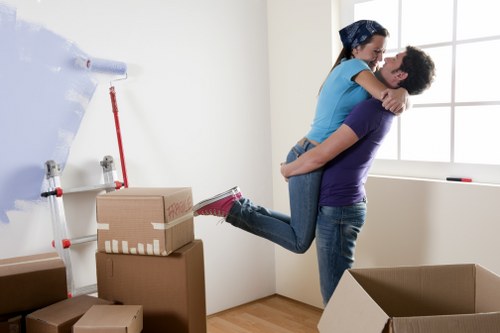 Packing team organising boxes for a Southwoodford home move